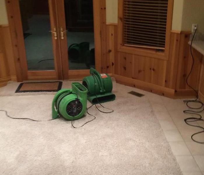 air movers in a carpeted area of a home