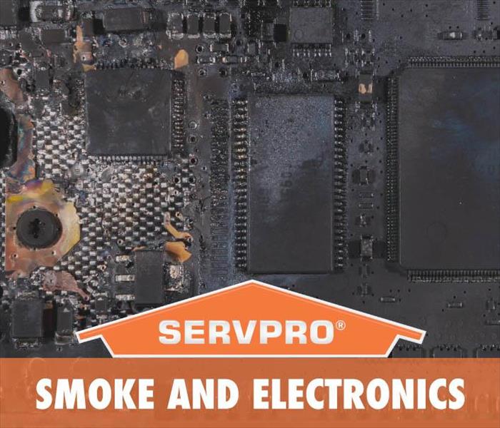 Background of an electronic damaged by fire with the LOGO of SERVPRO